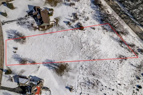 an aerial view of residential building and parking space