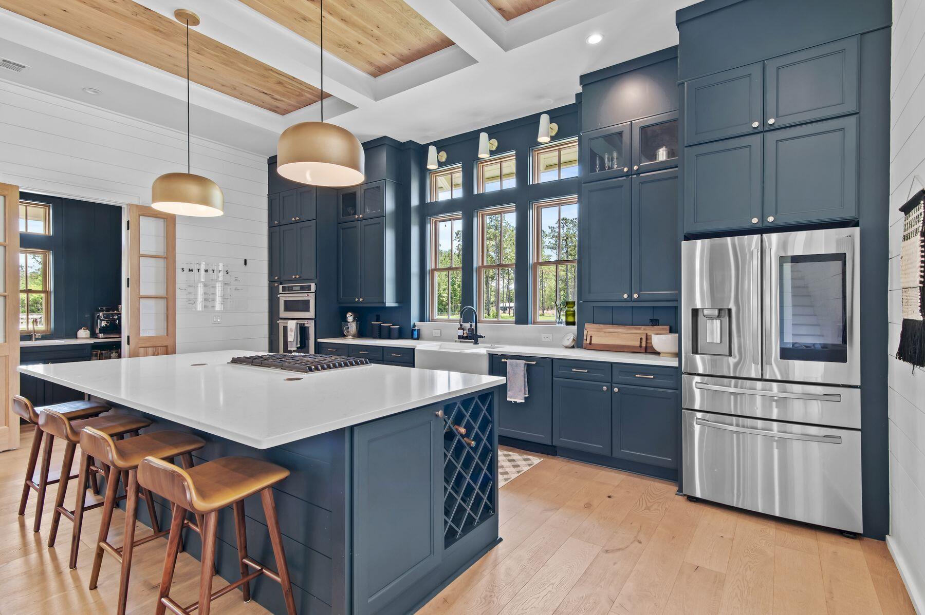 181 Jonathan Drive Freeport, FL 32439 - Photo 22 of 59 a kitchen with stainless steel appliances granite countertop a sink a stove and a refrigerator
