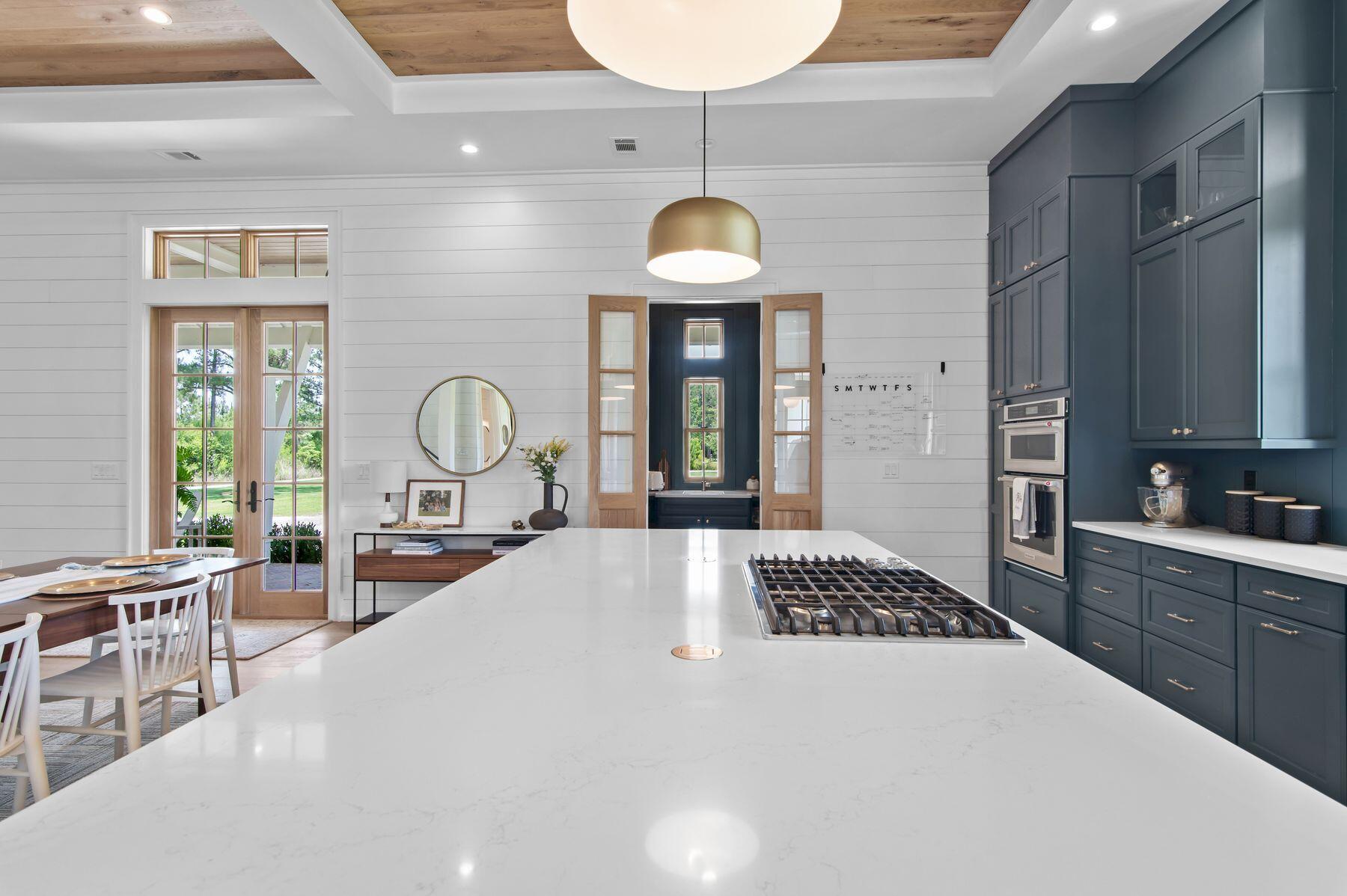 181 Jonathan Drive Freeport, FL 32439 - Photo 23 of 59 a large white kitchen with a large window and stainless steel appliances