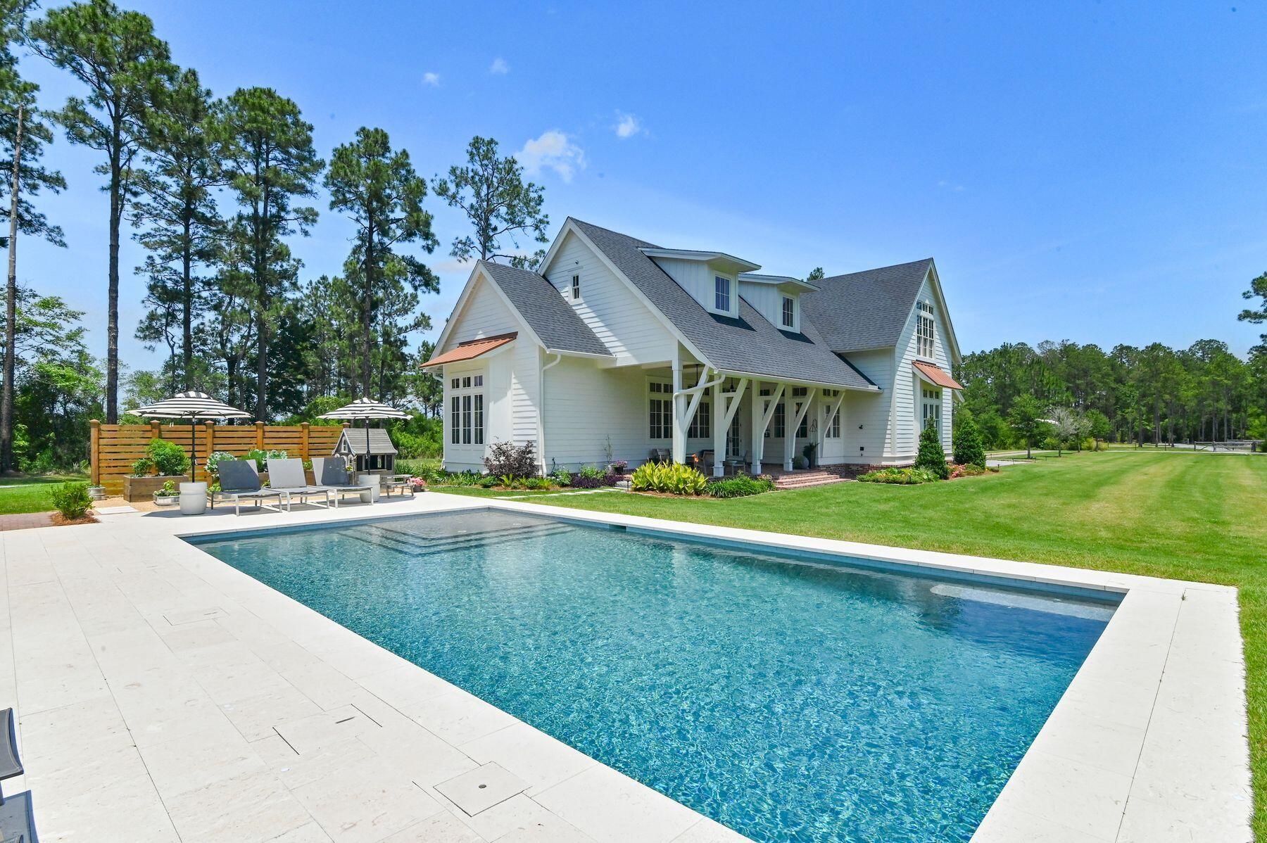 181 Jonathan Drive Freeport, FL 32439 - Photo 3 of 59 a view of an house with swimming pool and yard