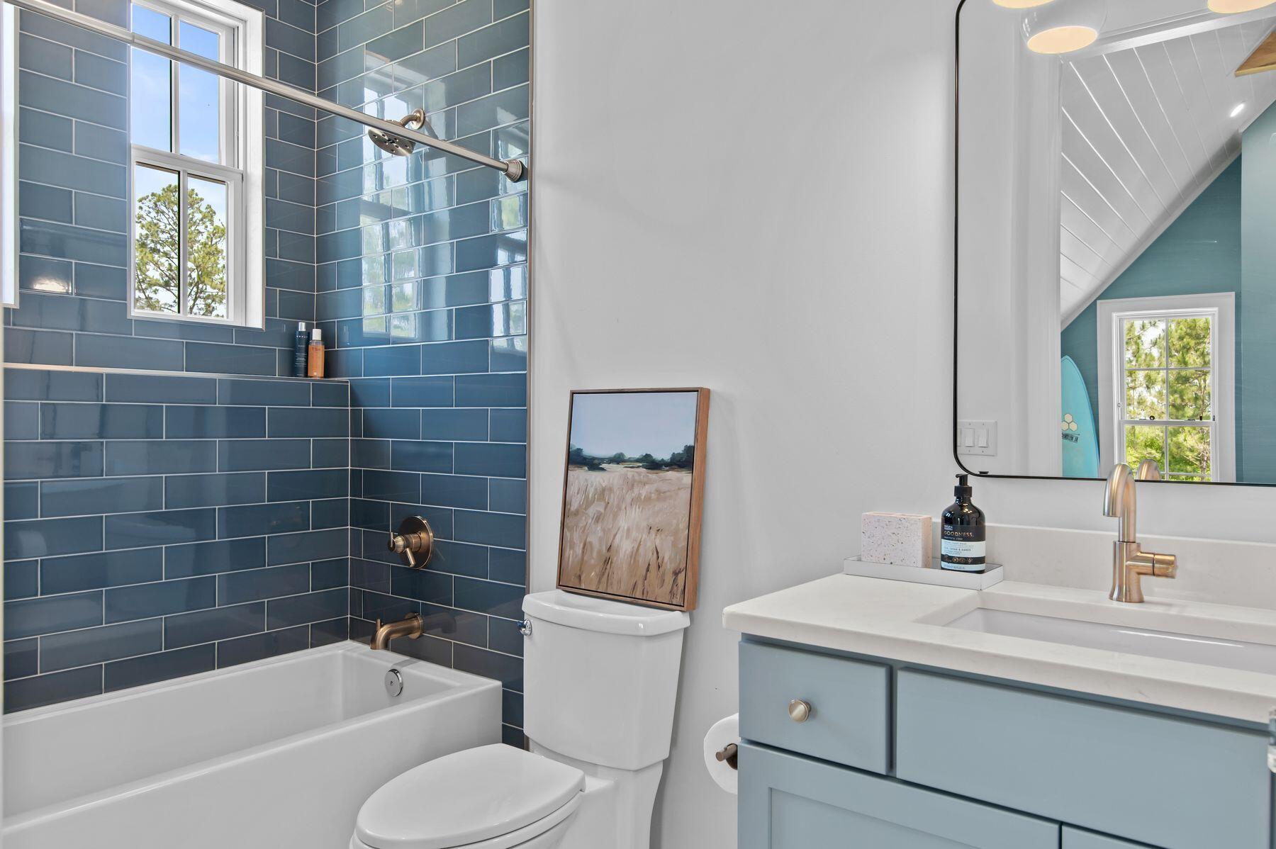 181 Jonathan Drive Freeport, FL 32439 - Photo 37 of 59 a bathroom with a sink toilet a mirror and bathtub