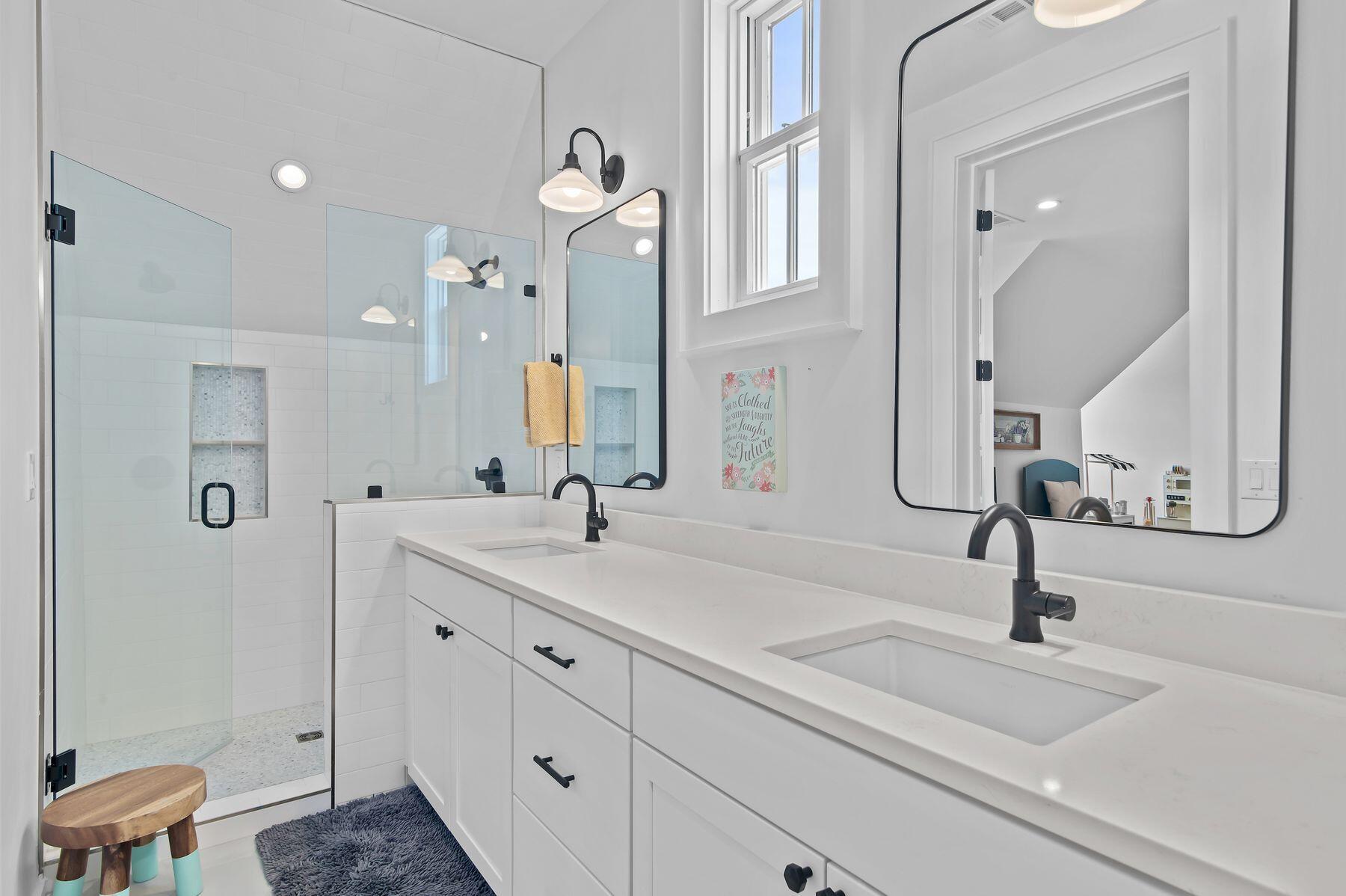 181 Jonathan Drive Freeport, FL 32439 - Photo 44 of 59 a bathroom with double vanity sink and a mirror