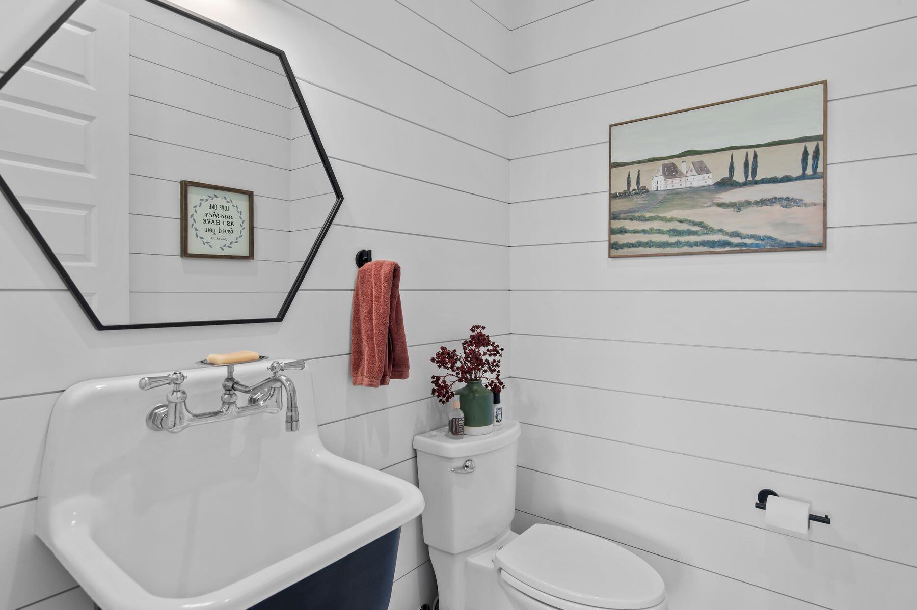 181 Jonathan Drive Freeport, FL 32439 - Photo 45 of 59 a bathroom with a toilet sink and mirror