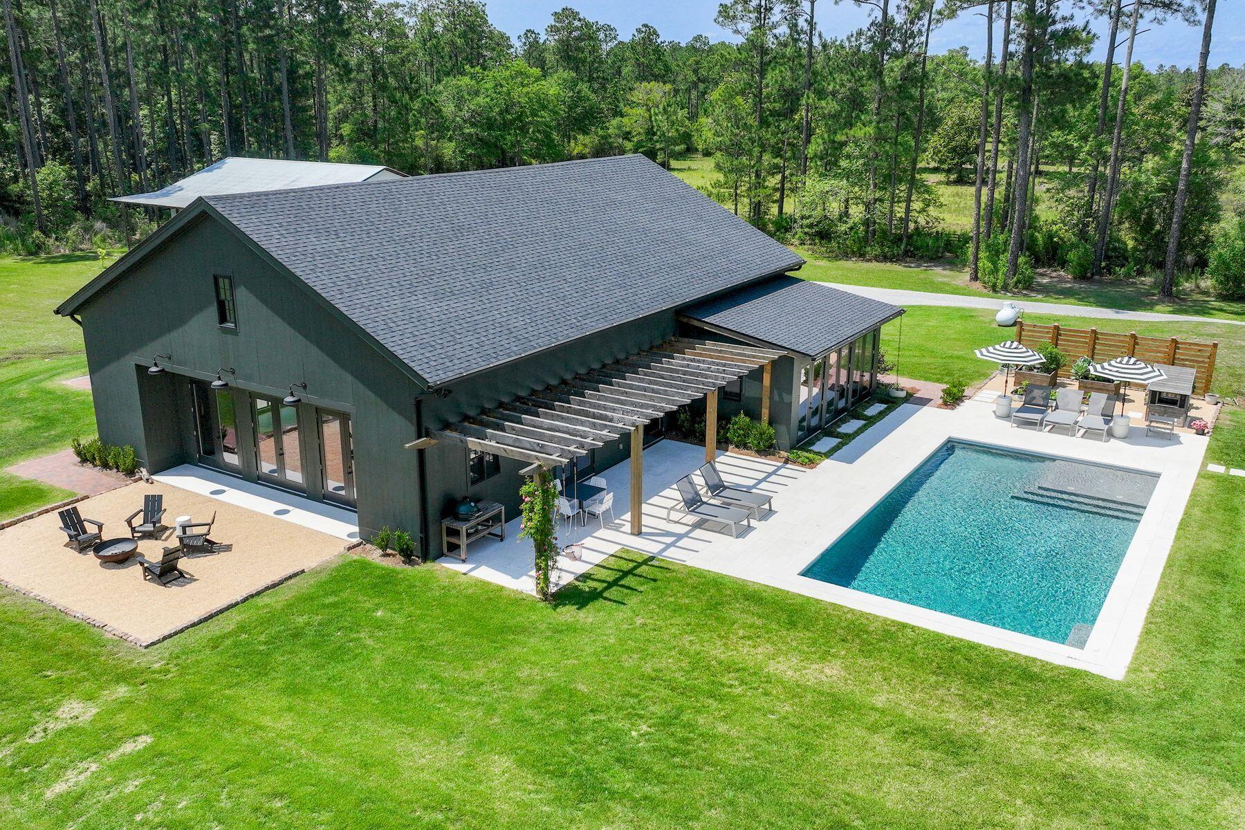 181 Jonathan Drive Freeport, FL 32439 - Photo 47 of 59 a aerial view of a house with garden and a patio