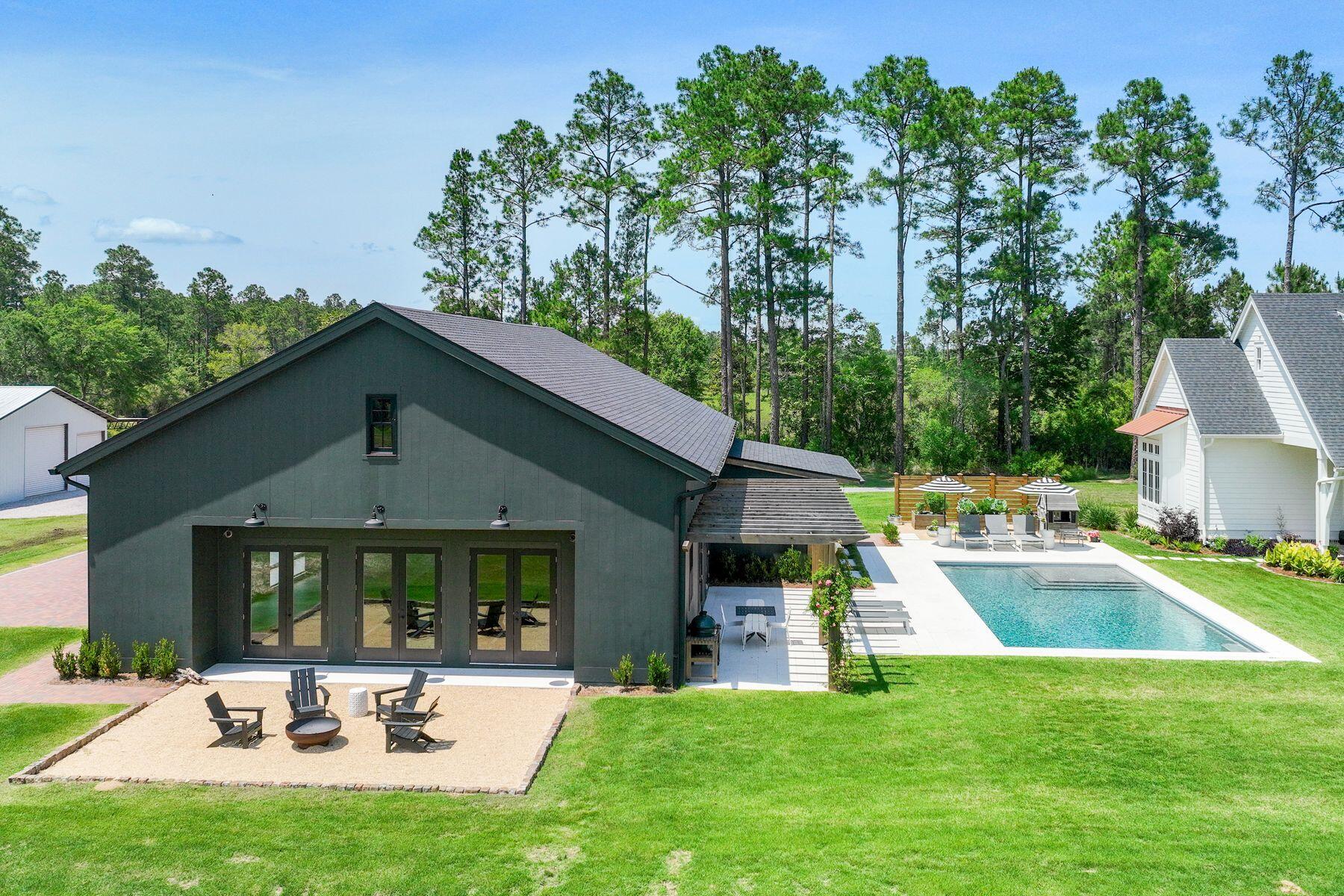 181 Jonathan Drive Freeport, FL 32439 - Photo 48 of 59 a view of a house with a yard patio and swimming pool