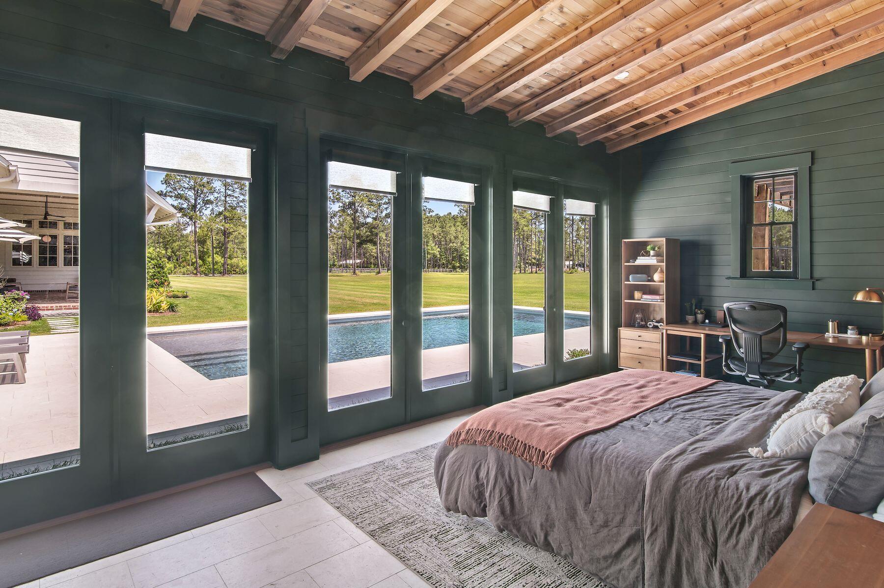 181 Jonathan Drive Freeport, FL 32439 - Photo 56 of 59 a bedroom with a large bed and a large window