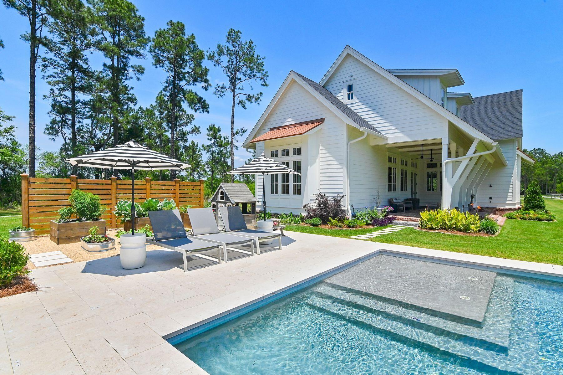 181 Jonathan Drive Freeport, FL 32439 - Photo 8 of 59 a view of a house with backyard sitting area and garden