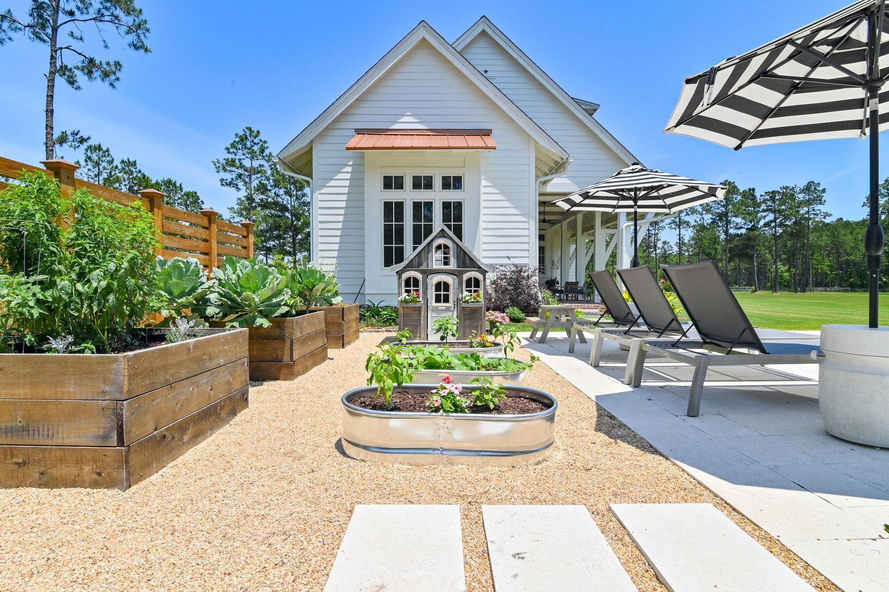 181 Jonathan Drive Freeport, FL 32439 - Photo 9 of 59 a view of a house with backyard water fountain and sitting area