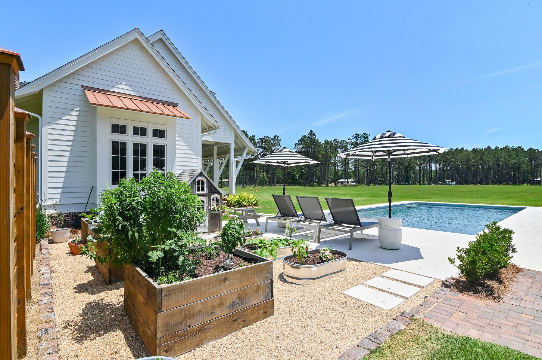 181 Jonathan Drive Freeport, FL 32439 - Photo 10 of 59 a view of a house with backyard sitting area and garden