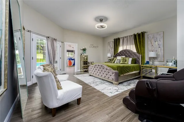 a bathroom with a granite countertop toilet a sink and a mirror