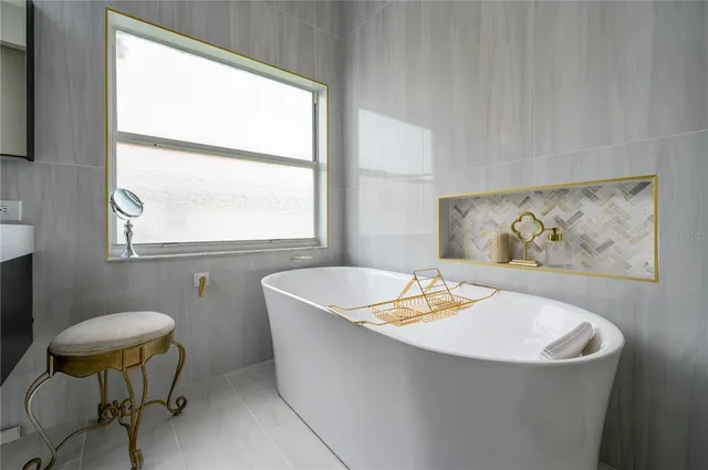 a bed room with a bed and a chandelier