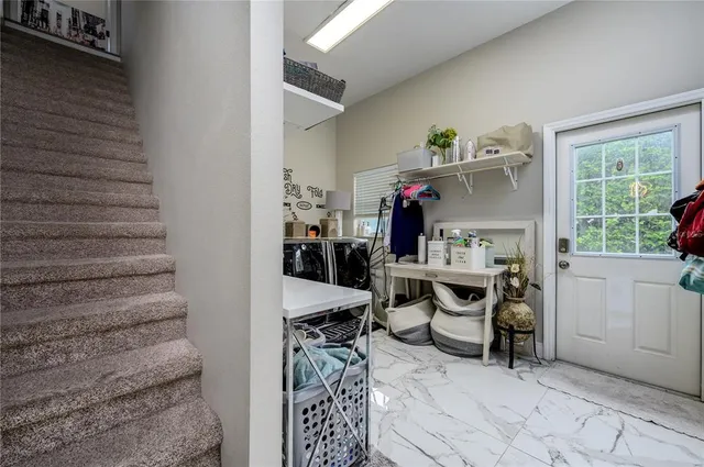 a bathroom with a sink a toilet a mirror and a tub