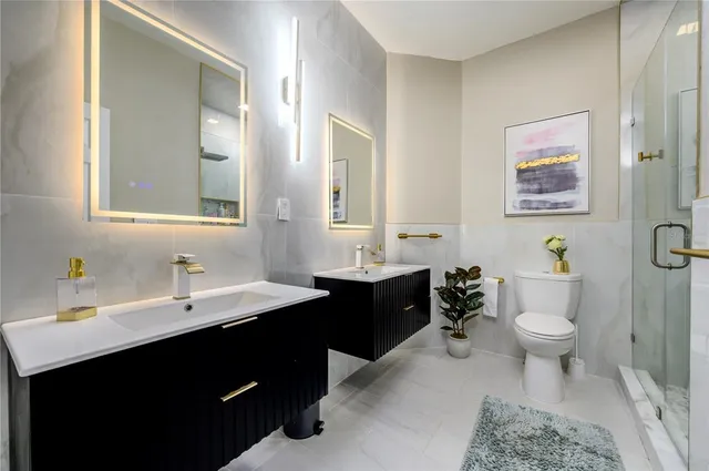 an aerial view of residential houses with outdoor space and street view