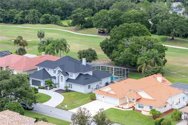 a living room with furniture fireplace and a window
