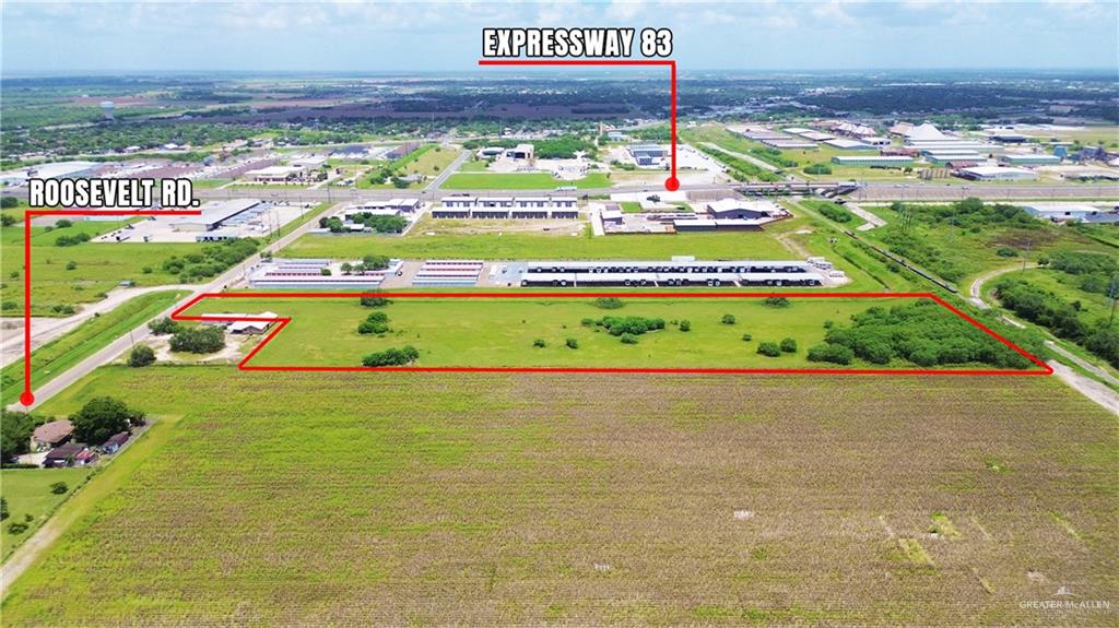 2605 Roosevelt Road Harlingen, TX 78552 - Photo 2 of 5 a sign that is sitting in the middle of a field