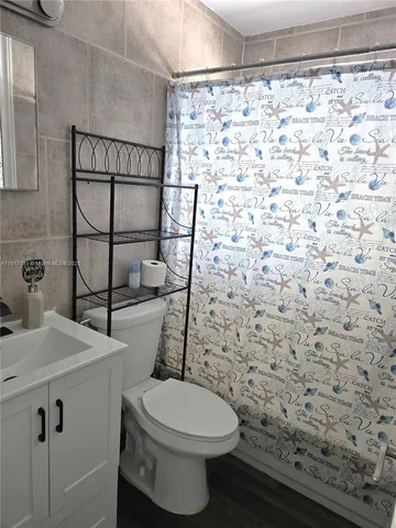 a bathroom with a toilet and a sink