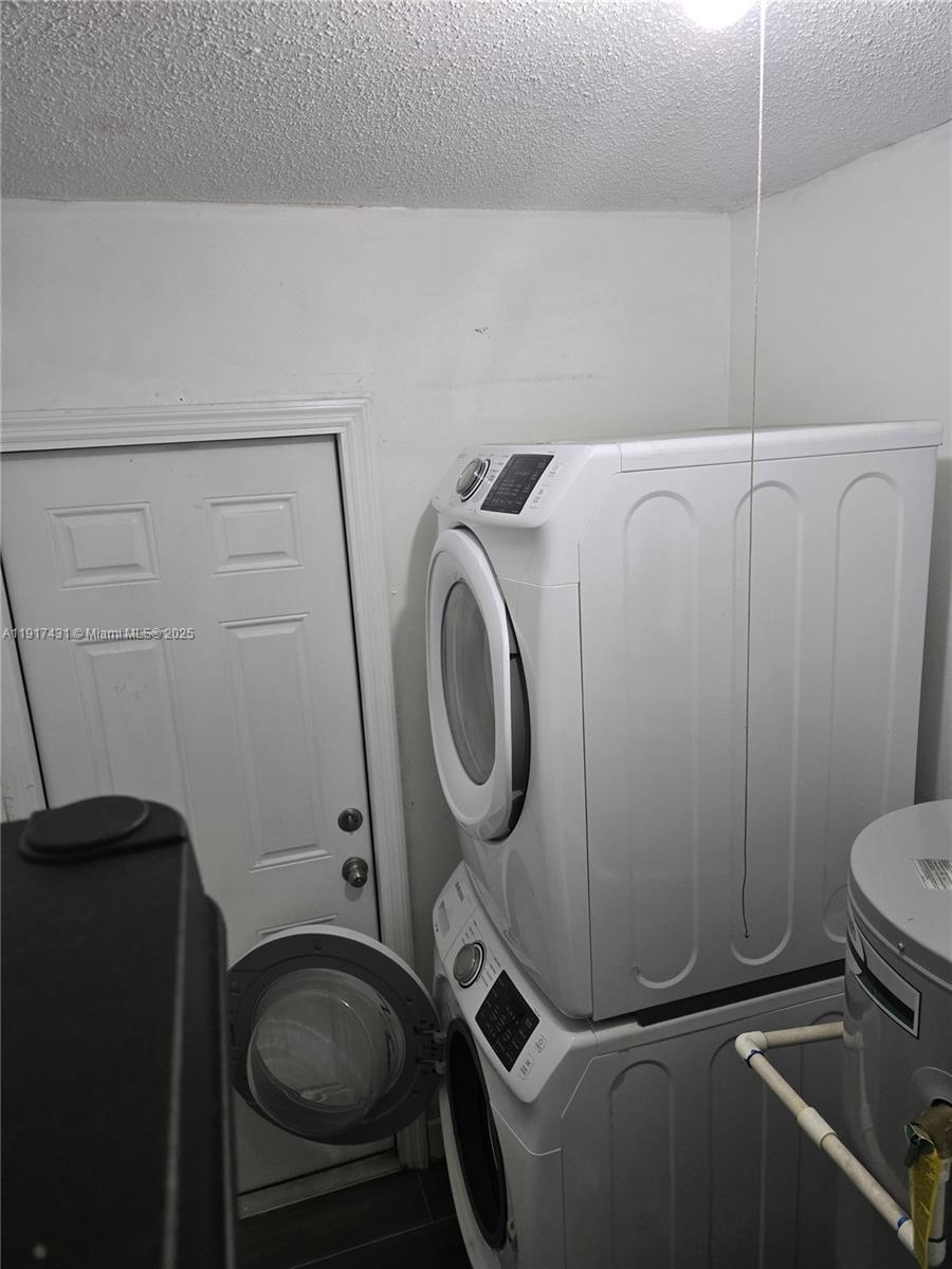 2190 Northeast 1st Lane Boynton Beach, FL 33435 - Photo 13 of 14 a utility room with dryer and washer