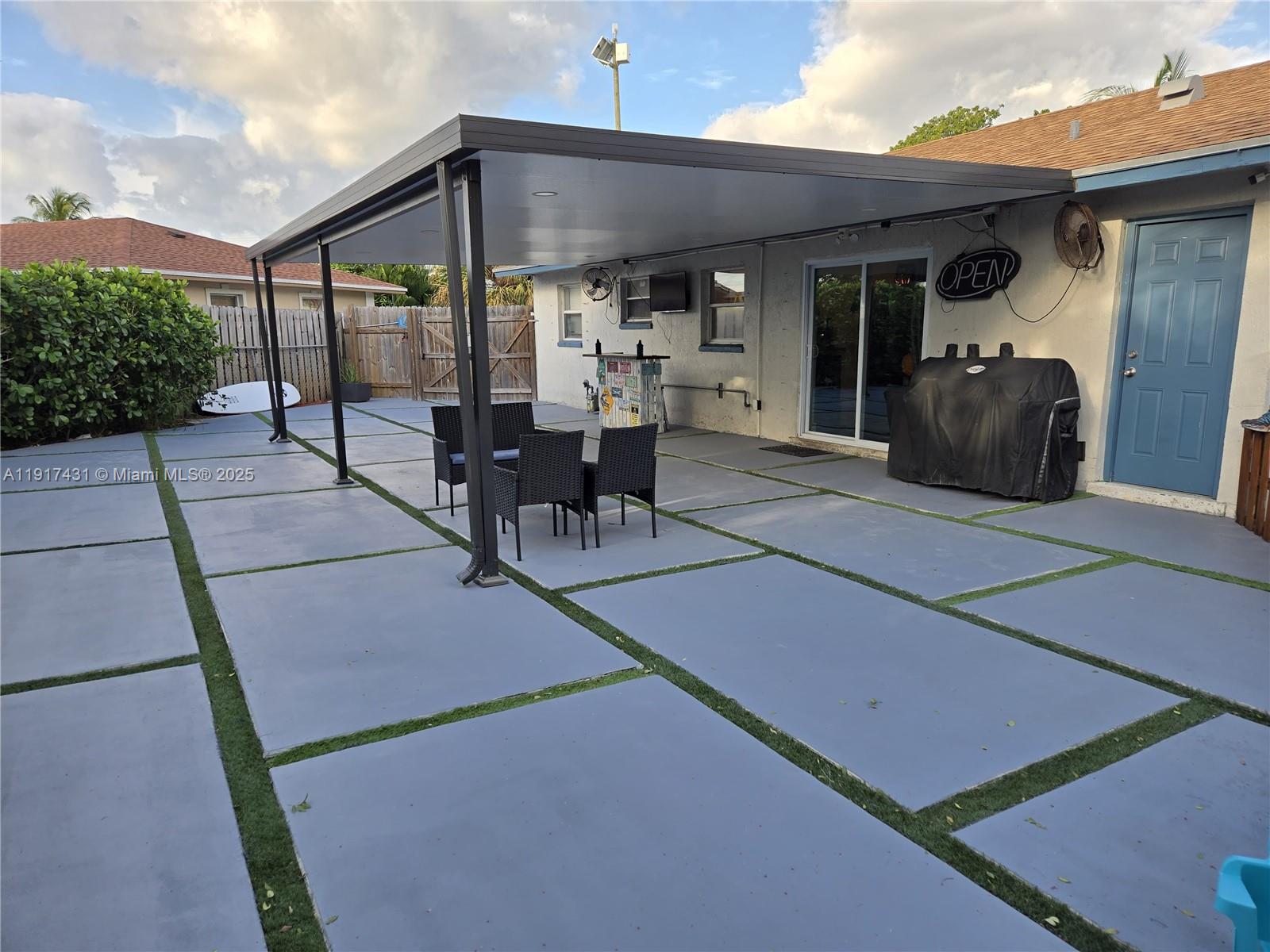 2190 Northeast 1st Lane Boynton Beach, FL 33435 - Photo 2 of 14 a view of a patio with table and chairs