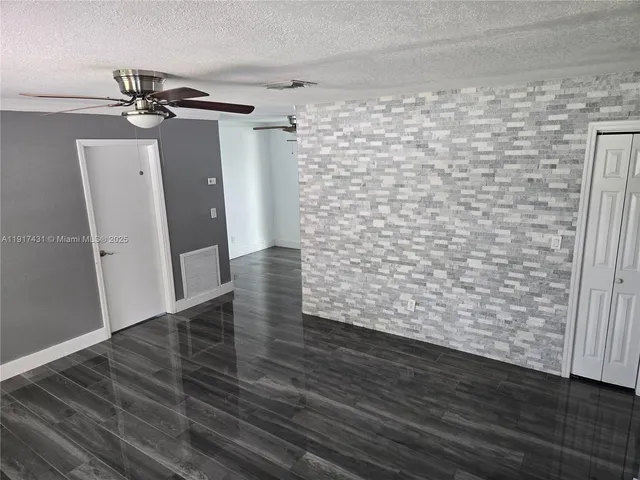 a view of wooden floor in an empty room