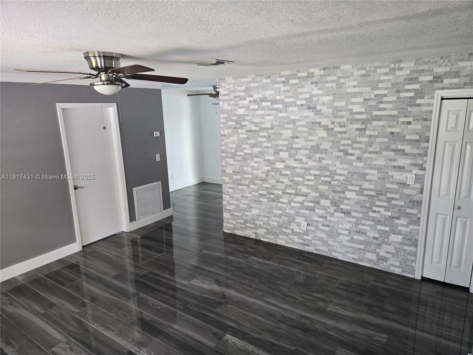 2190 Northeast 1st Lane Boynton Beach, FL 33435 - Photo 4 of 14 a view of wooden floor in an empty room