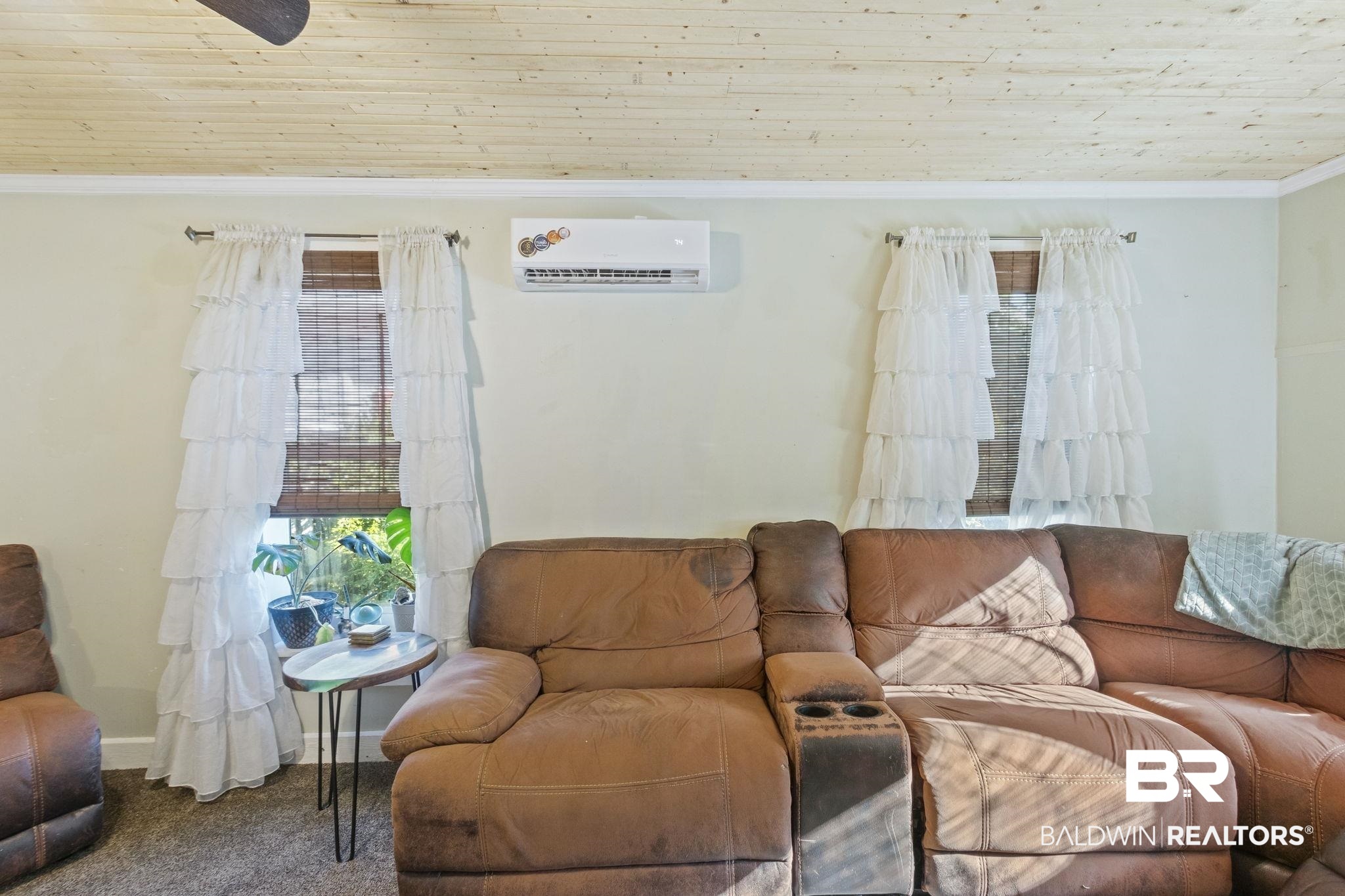 707 North Cedar Street Foley, AL 36535 - Photo 11 of 69 Living room featuring an AC wall unit, wood ceiling, carpet floors, and crown molding