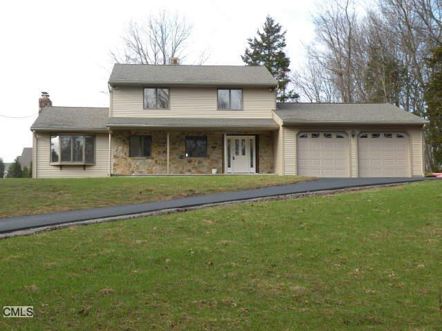 157 Porters Hill Road Trumbull, CT 06611 - Photo 1 of 1 a front view of a house with a garden