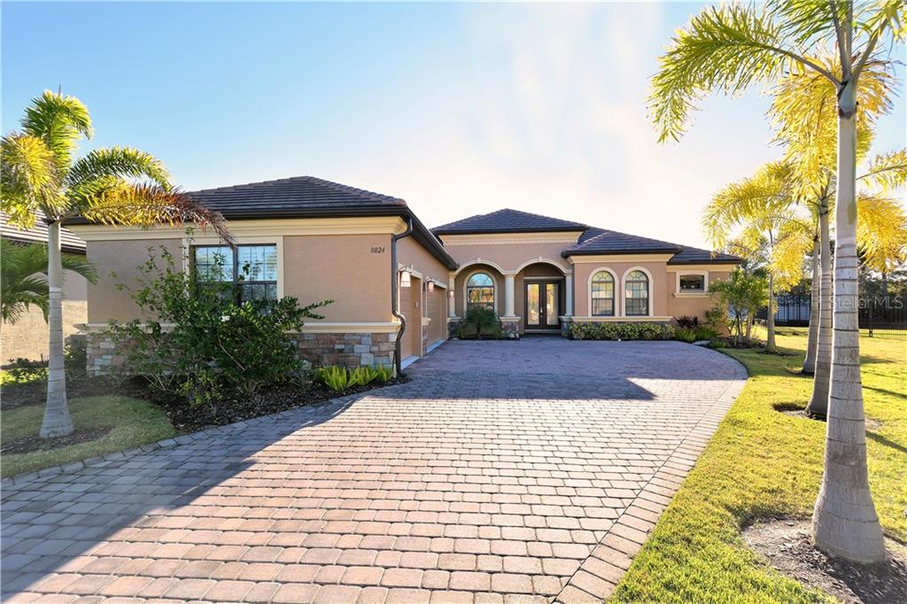 8024 Rio Bella Place University Park, FL 34201 - Photo 1 of 1 A pavered drive and slate roof set the stage for the beauty within...