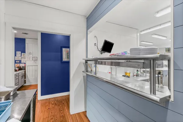 a kitchen with lots of counter top space and furniture