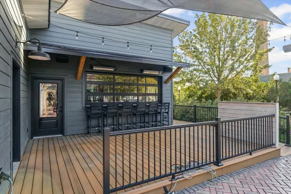 a view of a room with wooden floor and windows