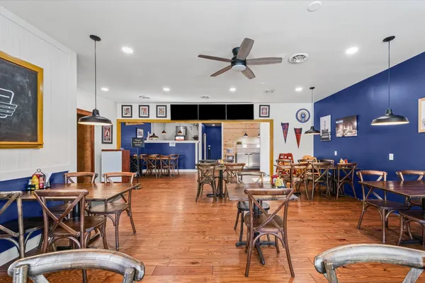 a view of a dining room with furniture window and wooden floor