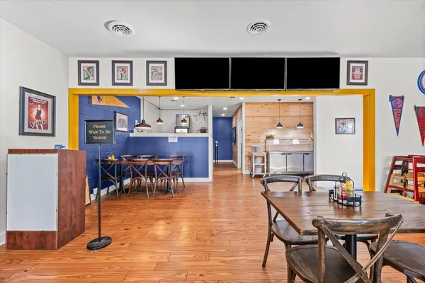 a kitchen with stainless steel appliances granite countertop a stove and a wooden cabinets