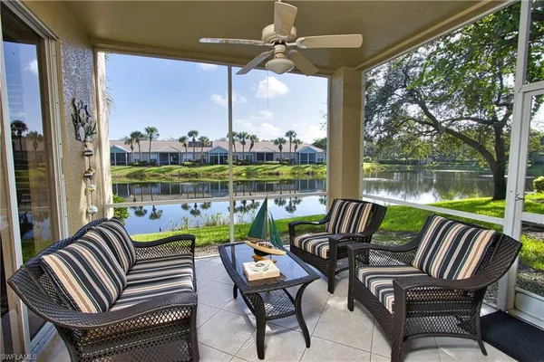 a view of a patio with couches chairs and a table