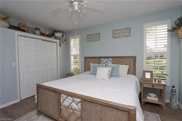 a bedroom with a large bed and a window