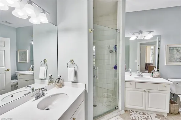 a bathroom with a sink vanity and a mirror