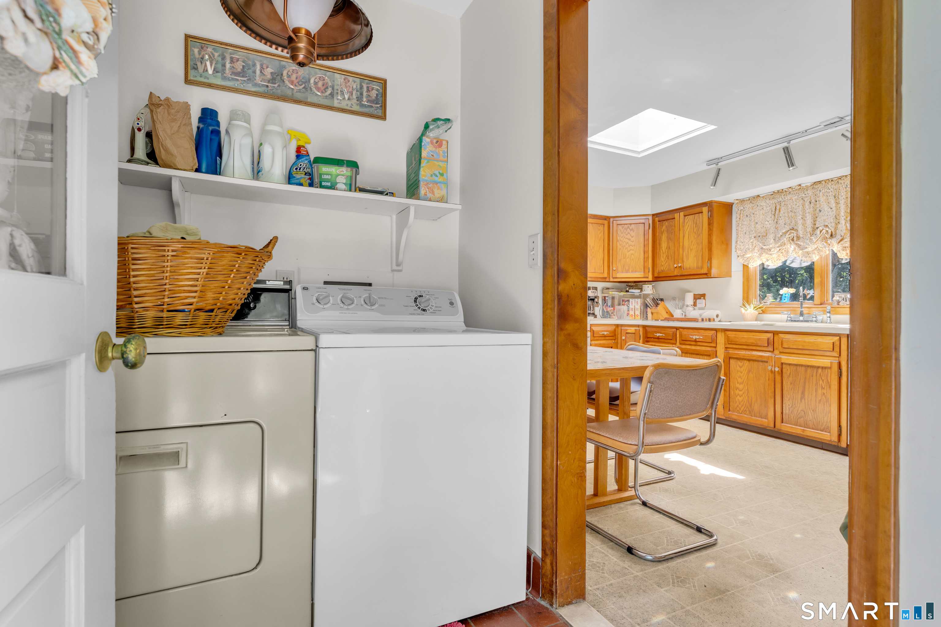 704 Towner Swamp Road Guilford, CT 06437 - Photo 14 of 39 Laundry room located directly off kitchen