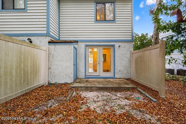 a view of a house with a door and wooden floor