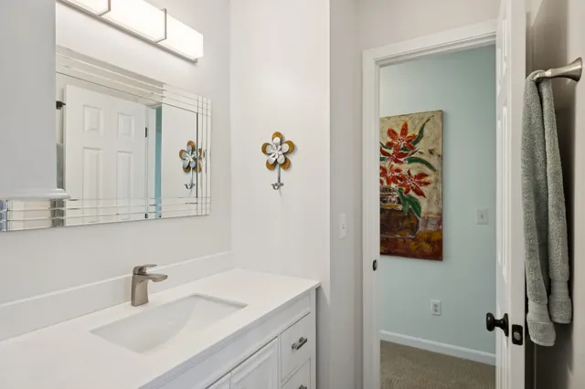 a bathroom with a sink and mirror