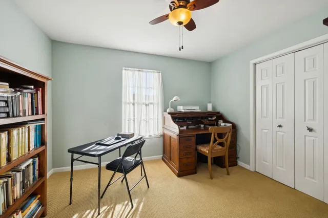 a view of a workspace with furniture