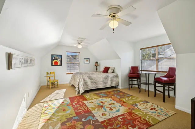 a bedroom with a bed furniture and a window