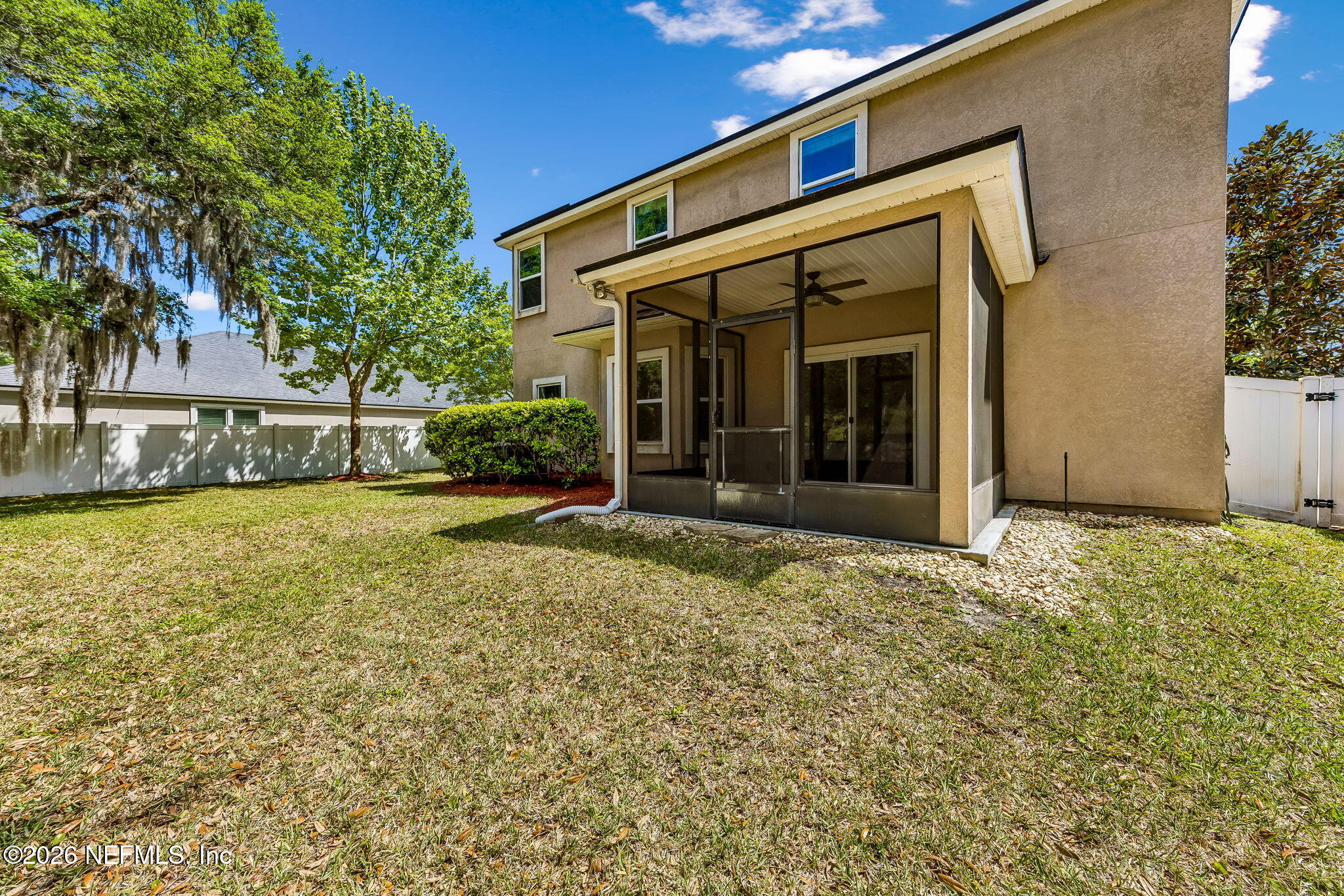 12198 Ridge Crossing Way Jacksonville, FL 32226 - Photo 46 of 67 a view of a house with a large window and yard