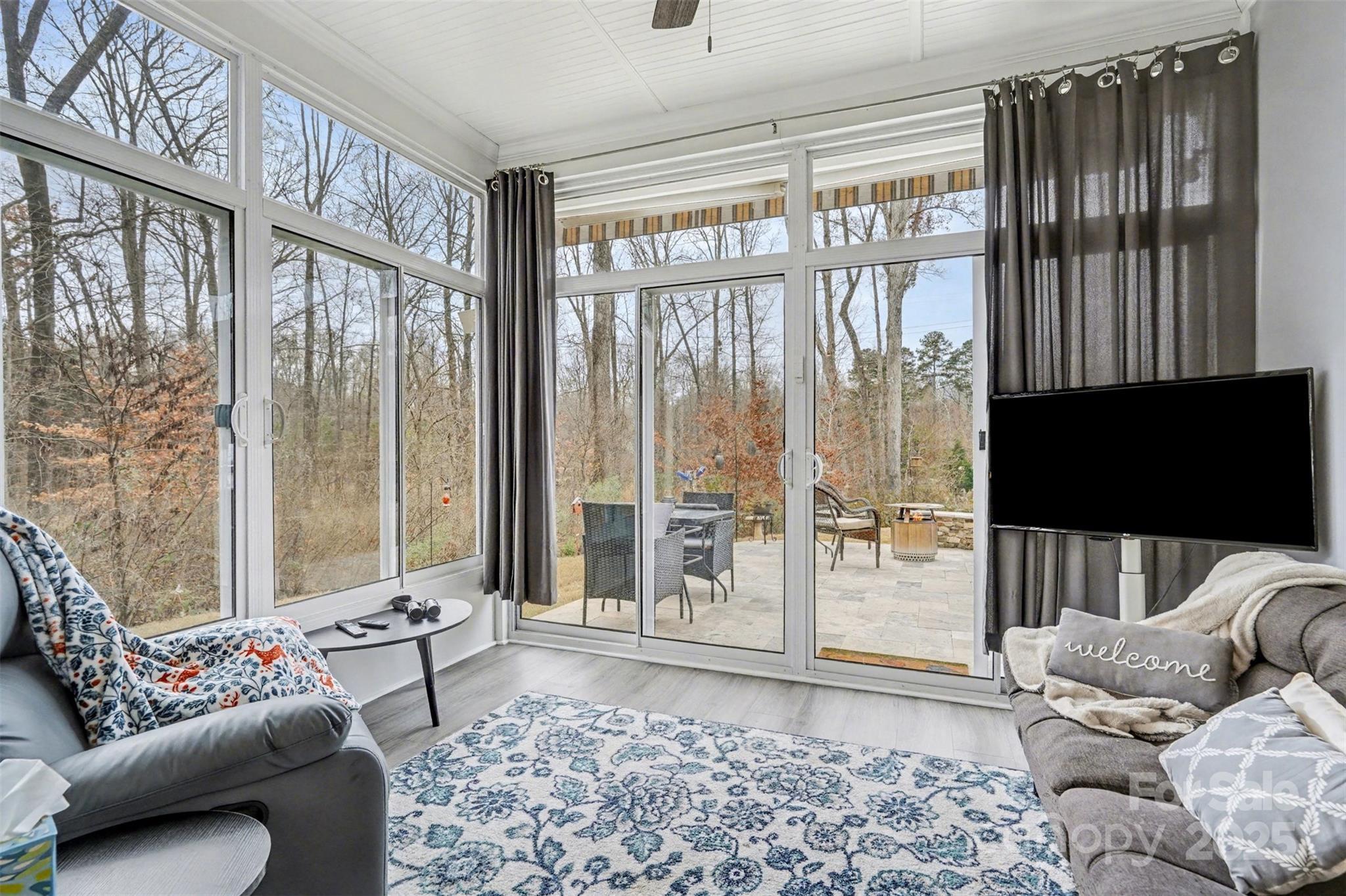 6220 Hailstone Road Charlotte, NC 28215 - Photo 16 of 37 a living room with furniture and a flat screen tv