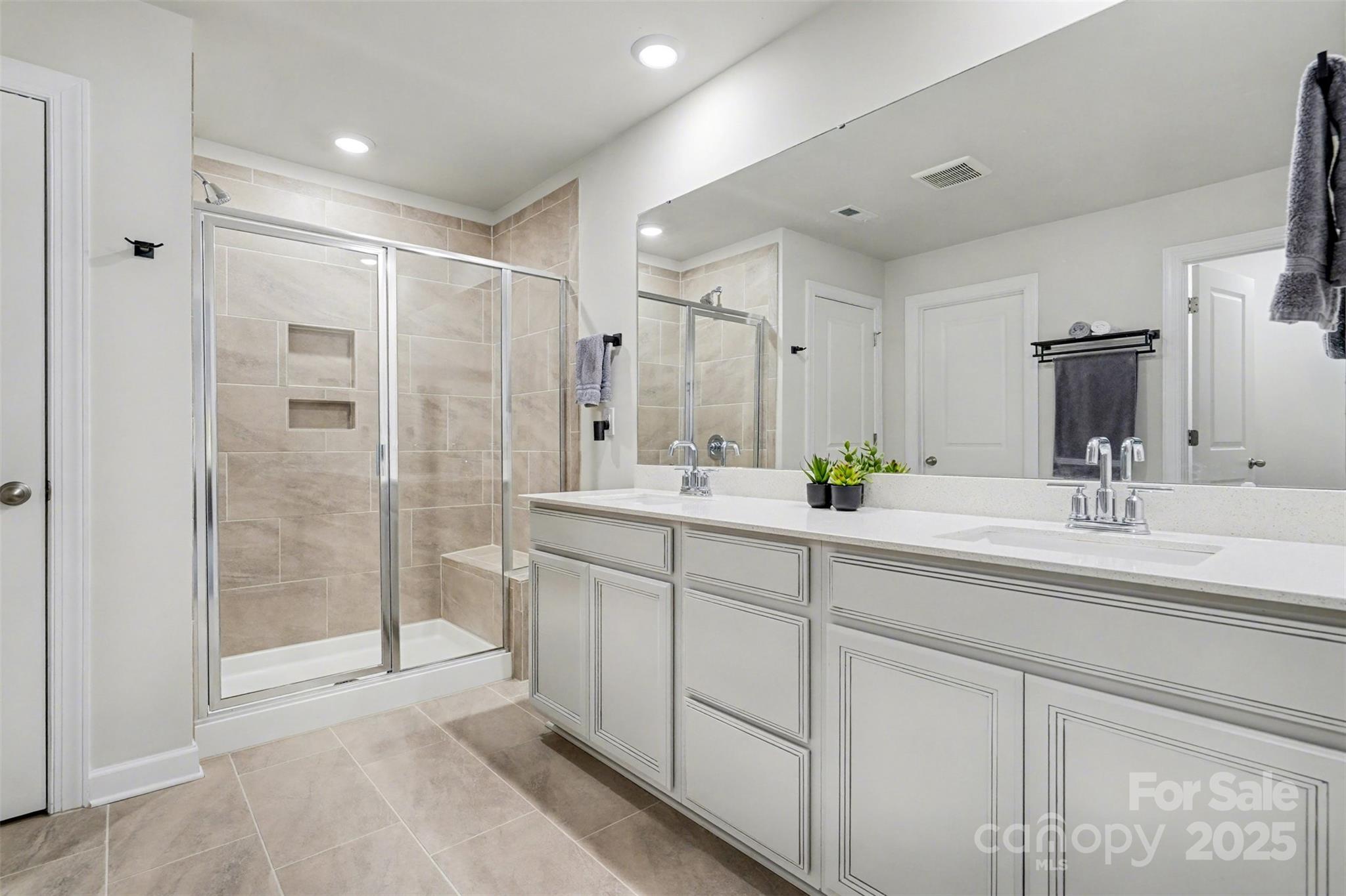 6220 Hailstone Road Charlotte, NC 28215 - Photo 20 of 37 a spacious bathroom with double sink and shower