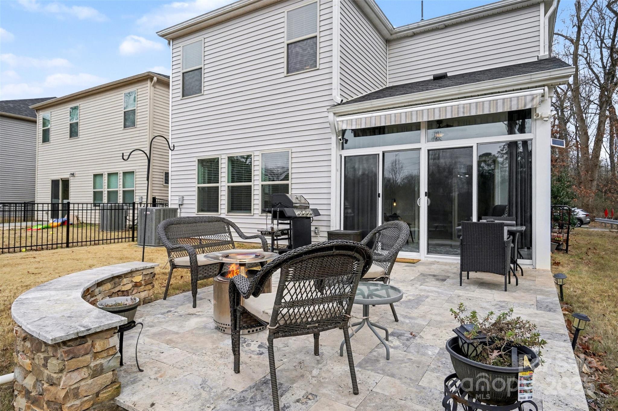 6220 Hailstone Road Charlotte, NC 28215 - Photo 26 of 37 a view of a patio with table and chairs with wooden floor and fence