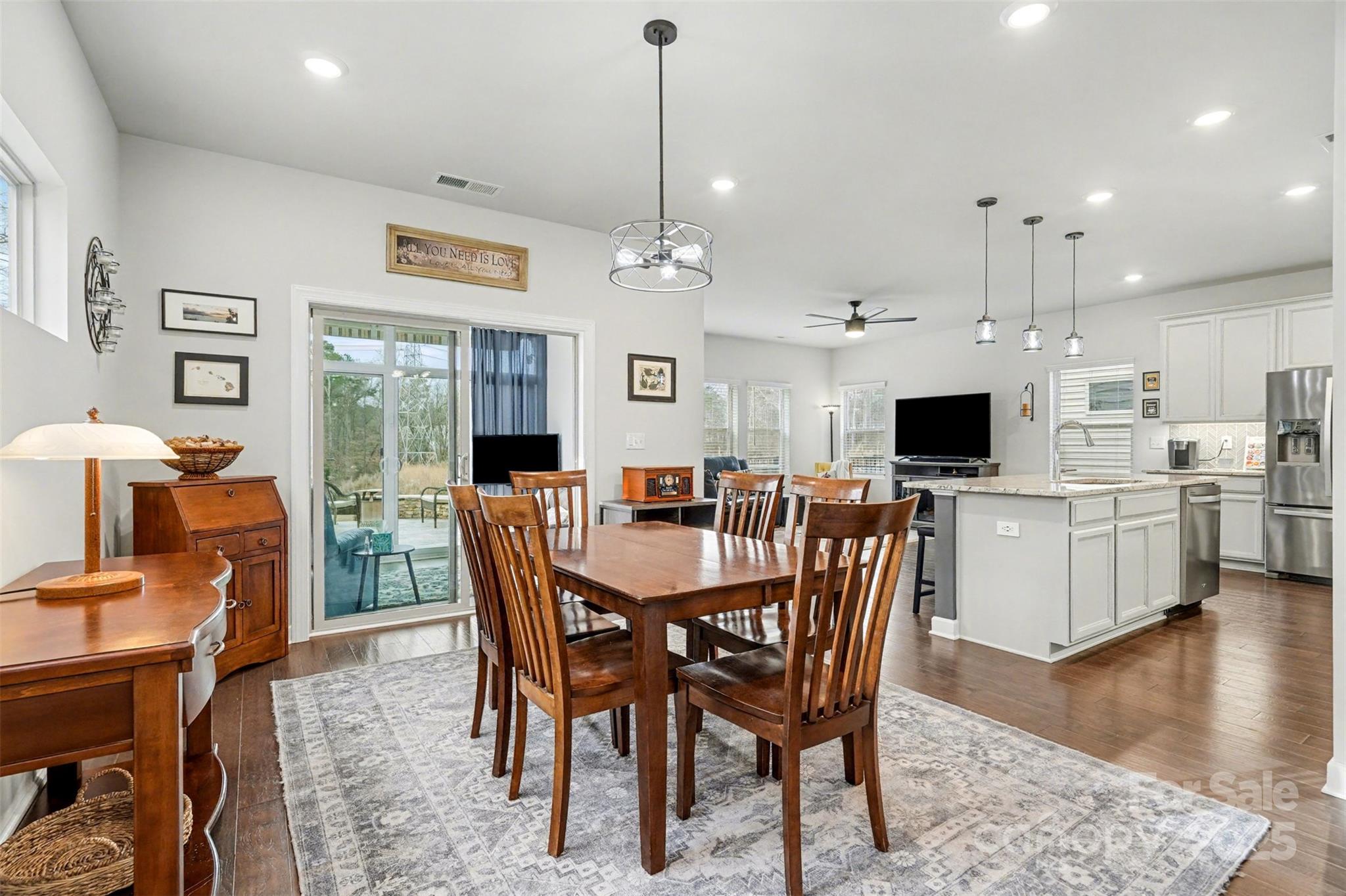 6220 Hailstone Road Charlotte, NC 28215 - Photo 6 of 37 a view of a dining room with furniture window and wooden floor