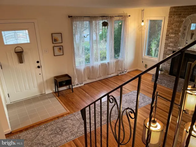 a reading room with furniture and a window