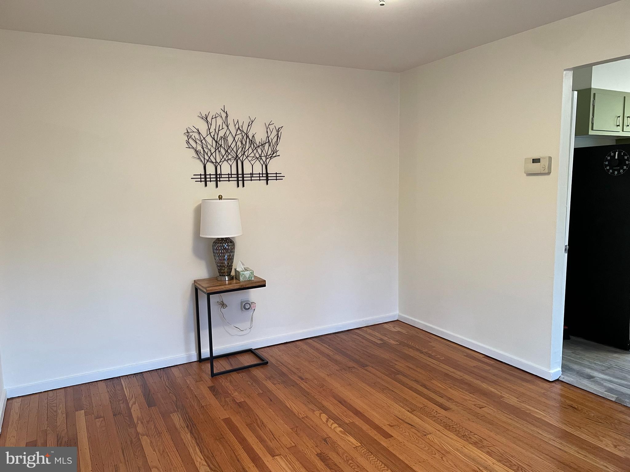 2400 Edge Hill Road Willow Grove, PA 19090 - Photo 18 of 43 a view of a room with wooden floor and a wall painting