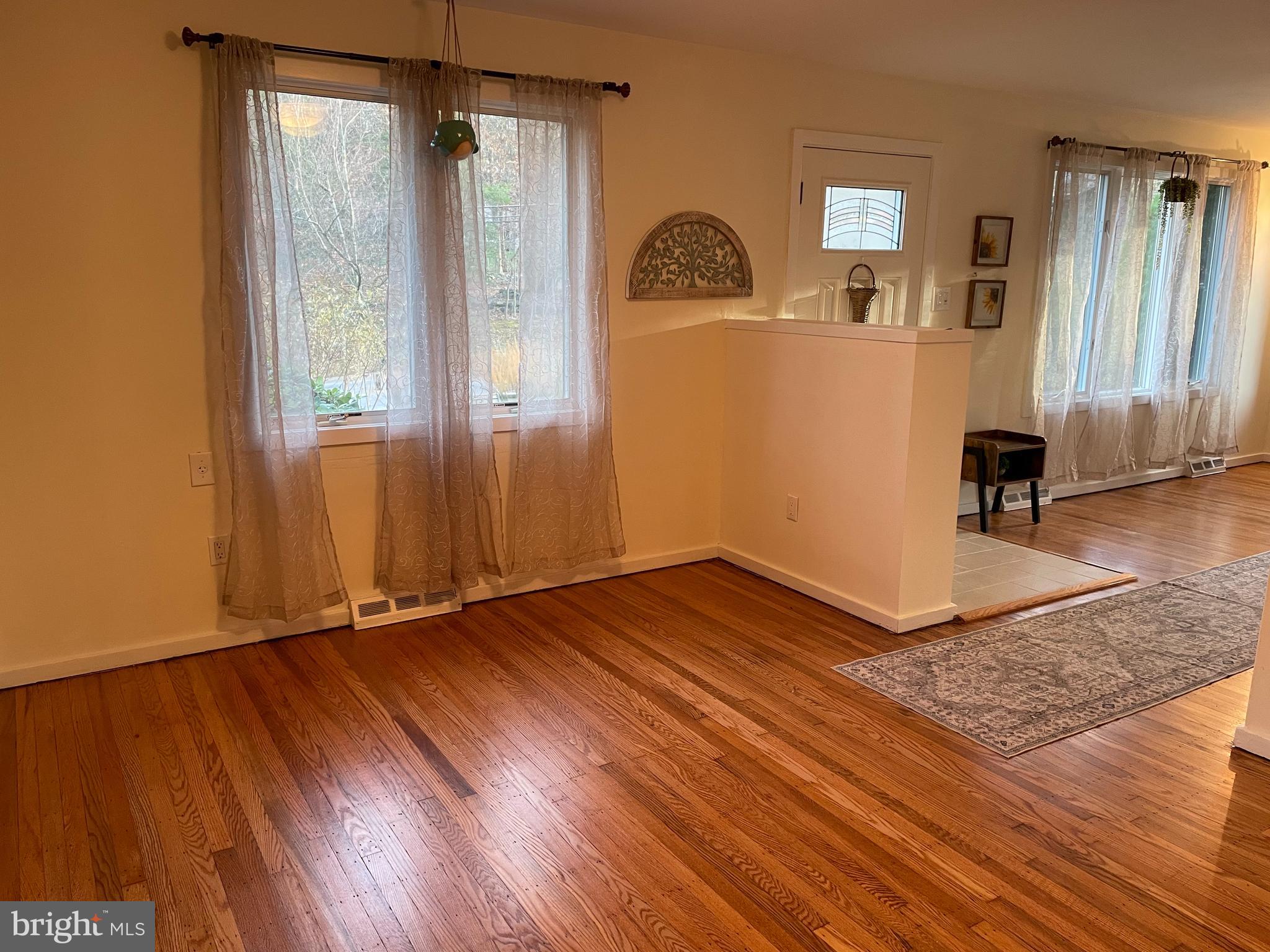 2400 Edge Hill Road Willow Grove, PA 19090 - Photo 19 of 43 an empty room with wooden floor and windows