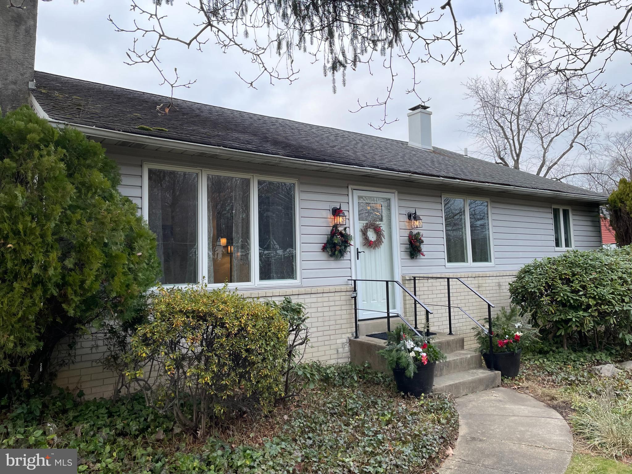 2400 Edge Hill Road Willow Grove, PA 19090 - Photo 2 of 43 a view of a house with potted plants and a table and chairs