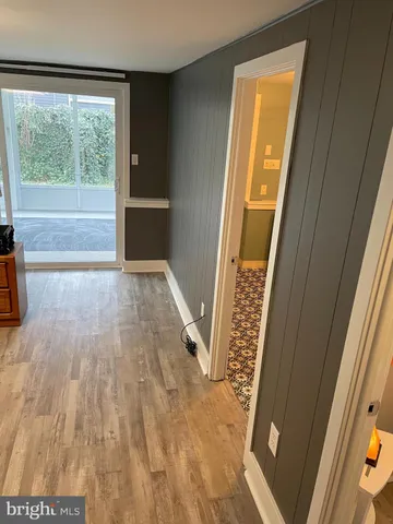 a view of front door with wooden floor
