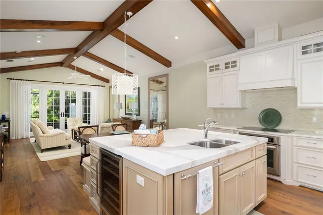 a kitchen with a sink and a refrigerator